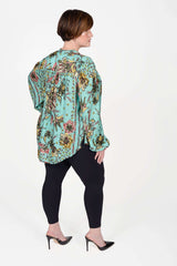 Mayes NYC Rosen Tie Neck Ruched Shoulder Blouse in Boho Scarf Print in Aqua color worn by model Max