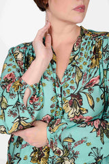 Mayes NYC Rosen Tie Neck Ruched Shoulder Blouse in Boho Scarf Print in Aqua color worn by model Max