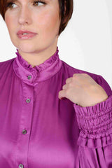 Mayes NYC Torie Blouse in Solid Berry color worn by model Max