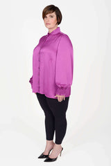 Mayes NYC Torie Blouse in Solid Berry color worn by model Max