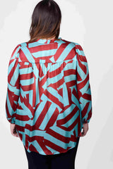 Mayes NYC Rosen Tie Neck Ruched Shoulder Blouse in Blue and Red Circle Stripes worn by model Megan Smith