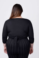 Mayes NYC Tamara Keyhole Wrap Top In Black worn by model Megan Smith