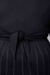 Mayes NYC Tamara Keyhole Wrap Top In Black worn by model Megan Smith