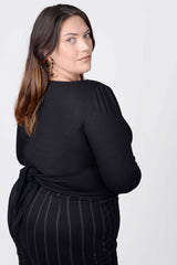 Mayes NYC Tamara Keyhole Wrap Top In Black worn by model Megan Smith