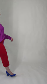 Mayes NYC Torie Blouse in Solid Berry color worn by model Max