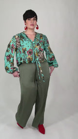 Mayes NYC Rosen Tie Neck Ruched Shoulder Blouse in Boho Scarf Print in Aqua color worn by model Max