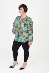 Mayes NYC Rosen Tie Neck Ruched Shoulder Blouse in Boho Scarf Print in Aqua color worn by model Max