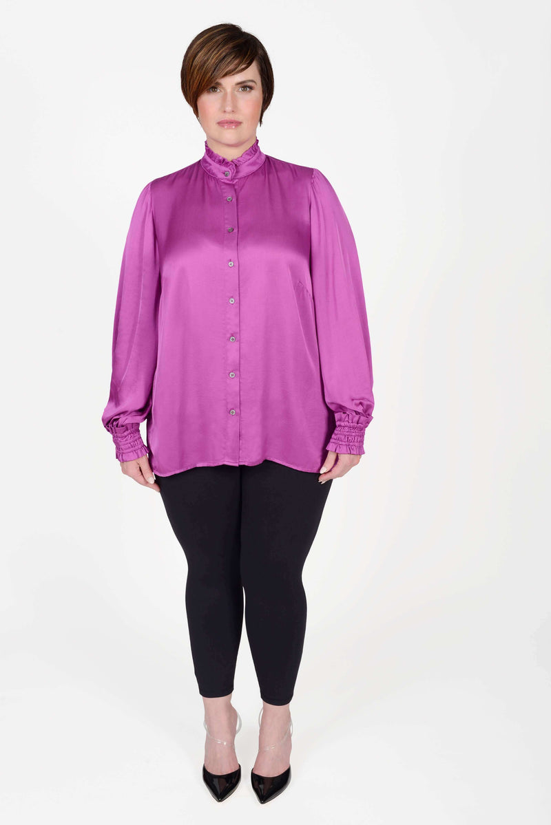 Mayes NYC Torie Blouse in Solid Berry color worn by model Max