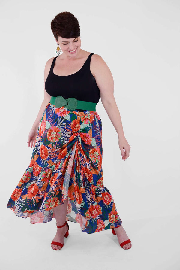Mayes NYC Erin Rushed Slit Skirt ion Tahiti Tropical flower Print with Cobalt based color worn by model Max