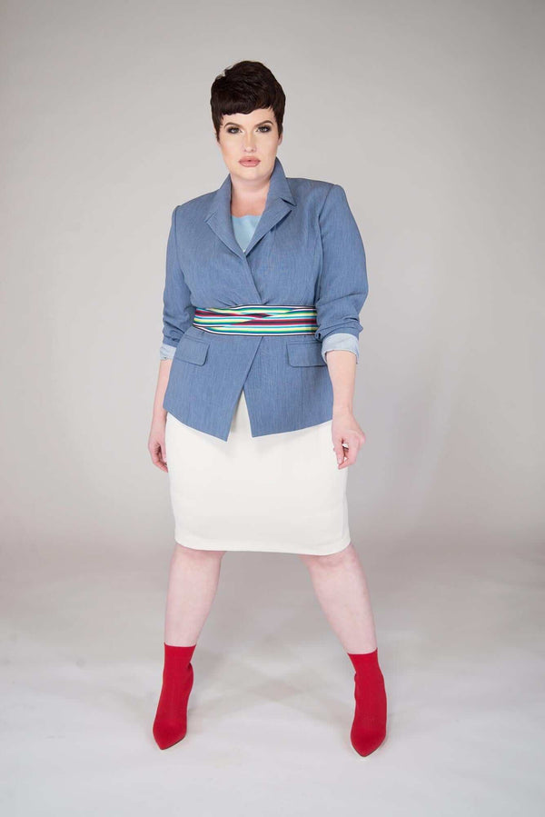 short haired model wears a Campanula Blue blazer with End on End Texture a Tailored Single Buttoned, Wide Notch Lapels with Single Welt Flap Pockets. Features include: Two-Way Stretch, Full Garment Lining, Functional Four Button Cuff on Sleeve, Single Center Vent, Princess Seemed Shaping.  Fabric is Viscose/Poly/Spandex garment is MADE IN NEW YORK CITY BY Mayes NYC