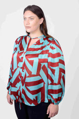 Mayes NYC Rosen Tie Neck Ruched Shoulder Blouse in Blue and Red Circle Stripes worn by model Megan Smith