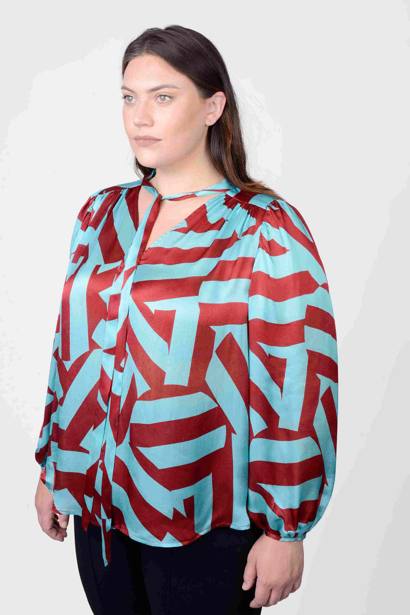 Mayes NYC Rosen Tie Neck Ruched Shoulder Blouse in Blue and Red Circle Stripes worn by model Megan Smith