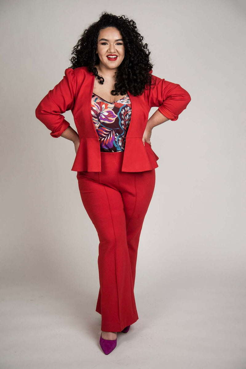 Mayes NYC Carter 70’s Flared Trouser in red worn by model Grace Delgado