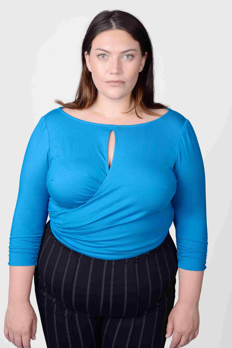 Mayes NYC Tamara Keyhole Wrap Top In Blue worn by model Megan Smith