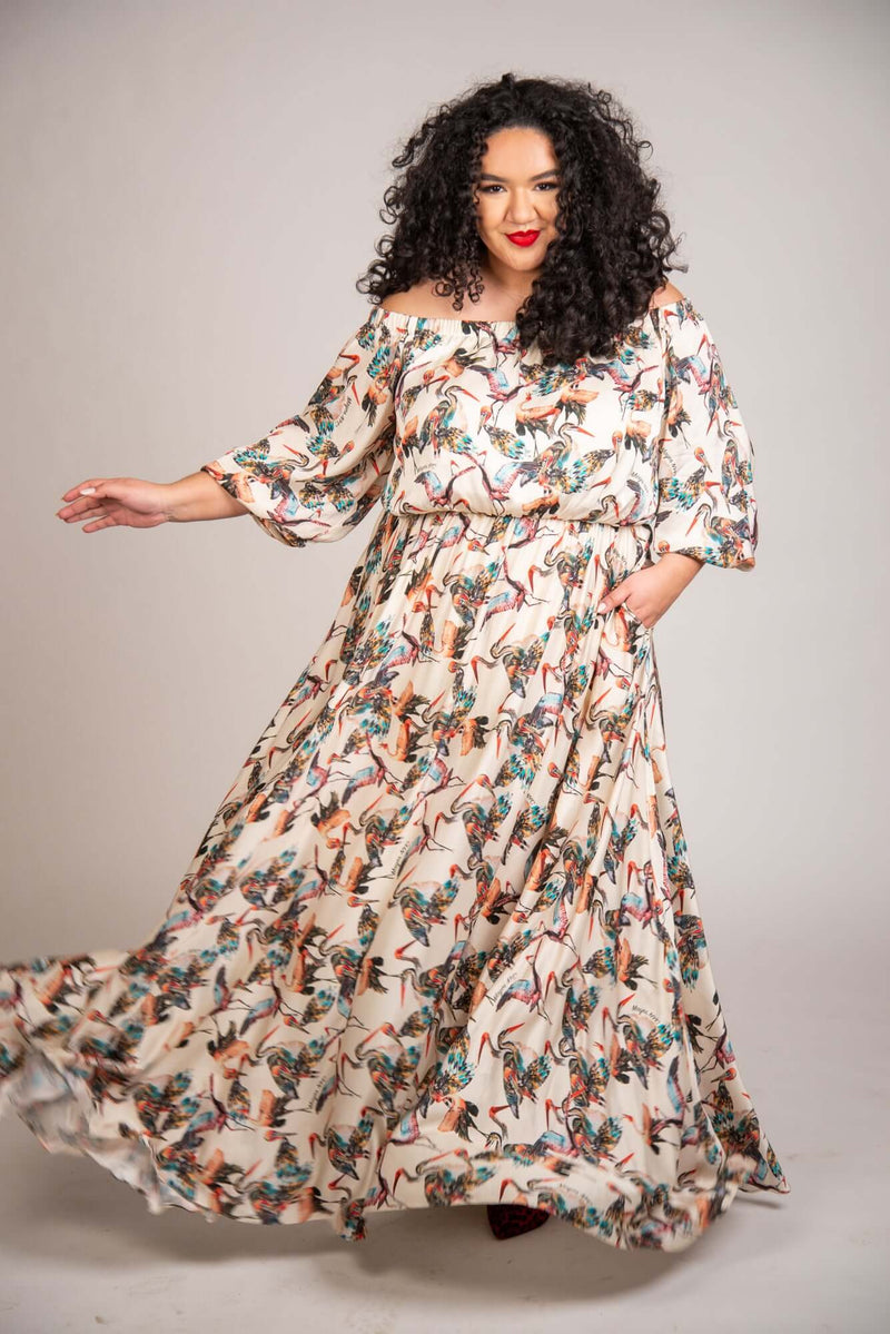 Mayes NYC Crane Maxi Dress in Cream-based color worn by model Grace Delgado
